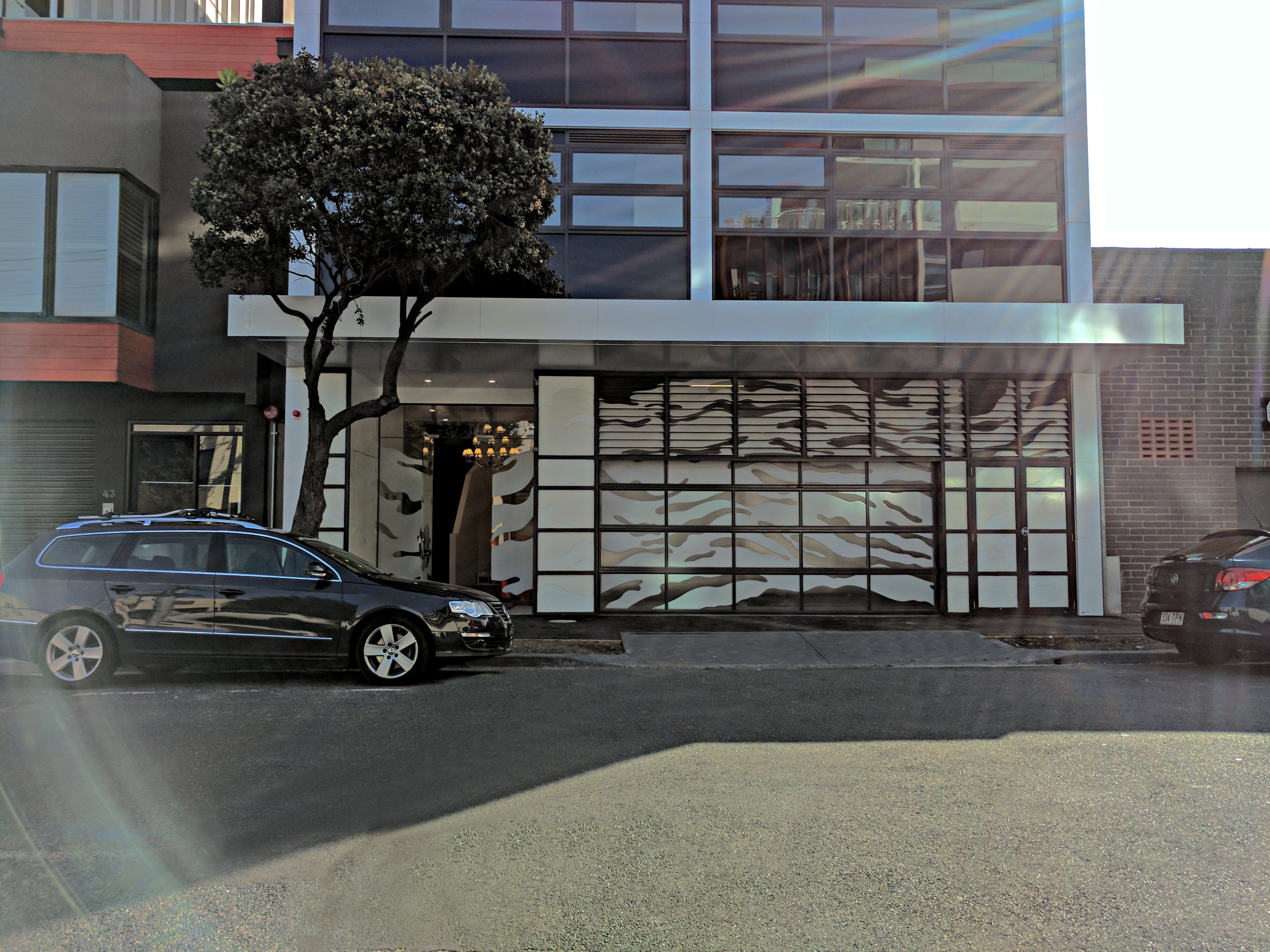 Space saving sectional folding door at Apartment building in Nott Street